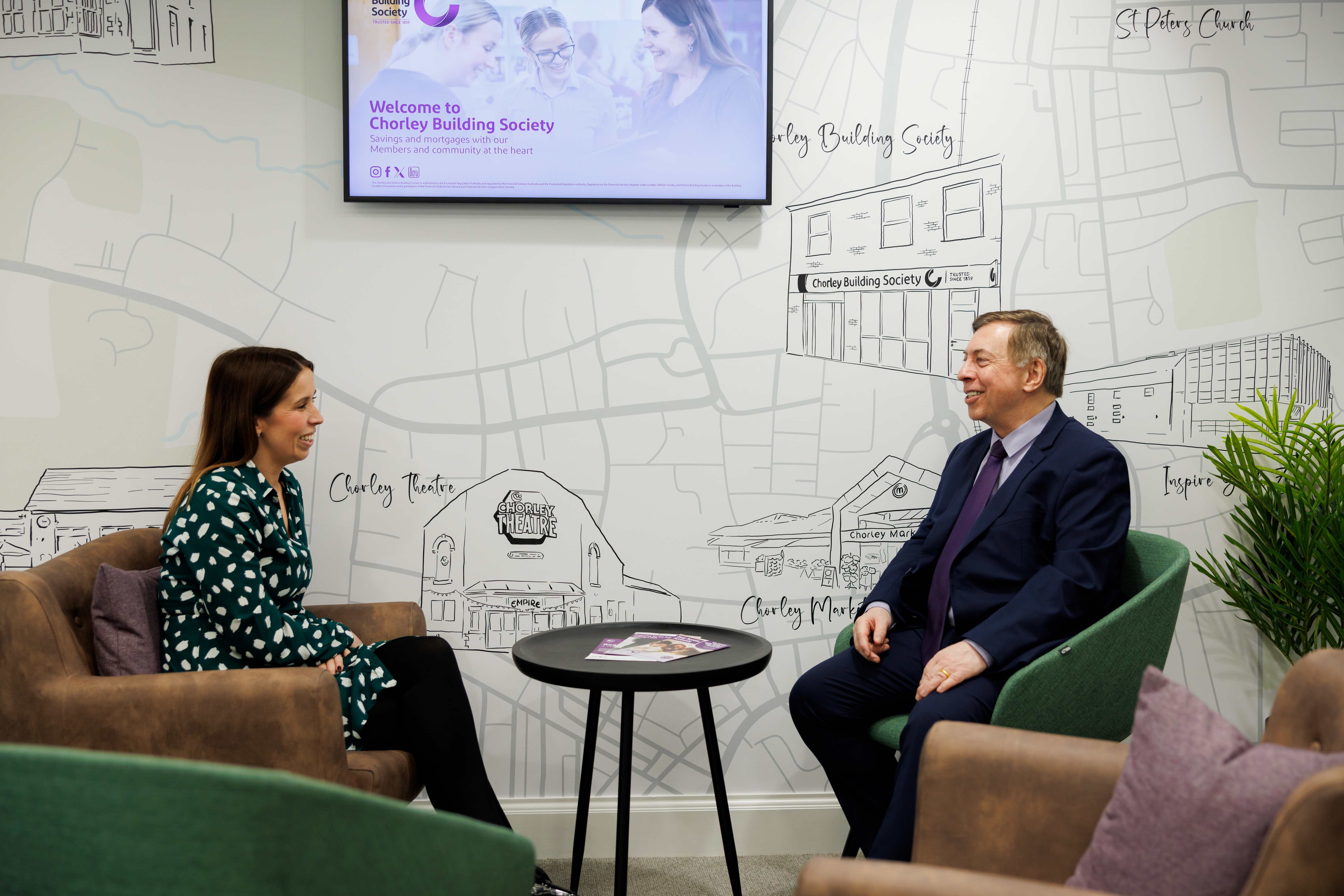 Kimberley Roby and Stephen Penlington sat at a coffee table